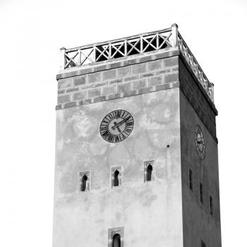 old brick tower in morocco africa village and the sky