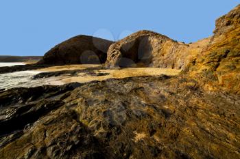 spain landscape rock stone sky cloud beach   water  in lanzarote  isle 
