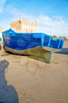   boat and sea      in africa morocco old castle brown brick  sky pier
