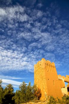 africa  in histoycal maroc  old construction  and the blue cloudy  sky