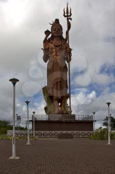 marble  wood gold statue of a Hinduism    Shiva vishnu Brahma in a temple near a lake in mauritius africa
