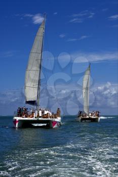 tropical lagoon hill navigable  froth cloudy  catamaran and coastline in mauritius