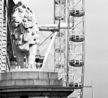 lion  london eye in the spring sky and white clouds