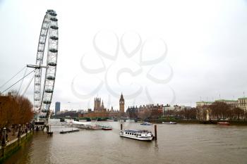 london eye in the spring sky and white clouds