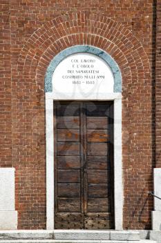church  samarate  varese italy the old door entrance and mosaic