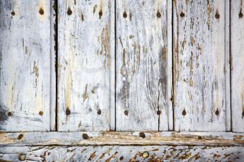  cross lombardy   arsago seprio abstract   rusty brass brown knocker in a  door curch  closed wood italy