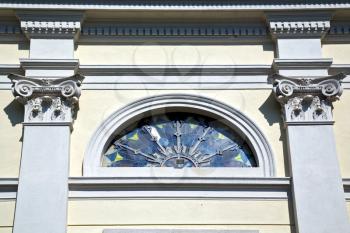 sumirago cross church varese italy the old rose window   and mosaic wall in the sky sunny day