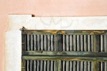 window  varese palaces italy   abstract  sunny day    wood venetian blind in the concrete  brick