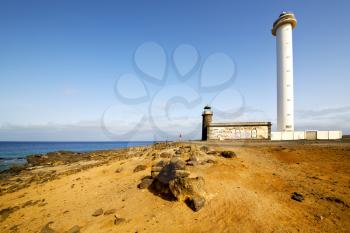 atlantic ocean lanzarote lighthouse and rock in the blue sky   arrecife teguise spain
