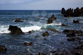  rock spain  sky light  beach water  in lanzarote  isle foam  landscape  stone  cloud   
