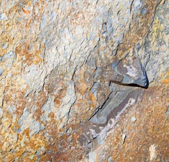 rocks stone and red orange gneiss in the wall of morocco