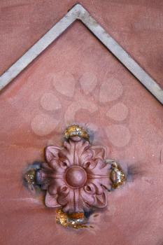 abstract  rusty brass brown knocker in a   closed wood door olgiate olona varese italy
