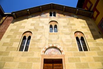 sunny day italy church tradate  varese  the old door entrance and windows  mosaic