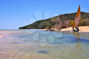 nosy be isthmus isle boat palm  rock stone branch hill lagoon and coastline in madagascar 
