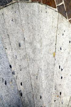 direction  sanpietrini busto arsizio  street lombardy italy  varese abstract   pavement of a curch and marble

