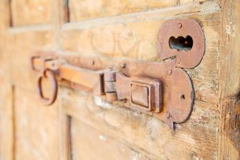 europe old in  italy  antique close brown door and rusty lock  closeup