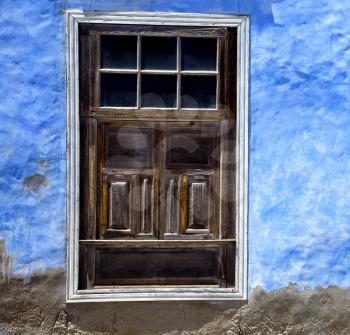 brown wood   window in a blue wall arrecife lanzarote spain