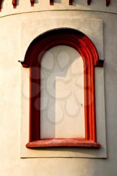  italy  lombardy     in  the barza     old   church   closed brick tower   wall rose   window tile   
