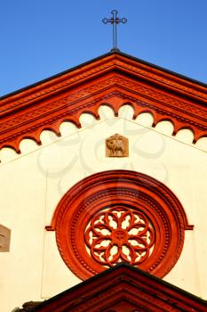  italy  lombardy     in  the barza     old   church   closed brick tower   wall rose   window tile  shutter