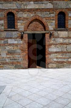  italy  lombardy     in  the besnate   old   church  closed brick tower      wall
