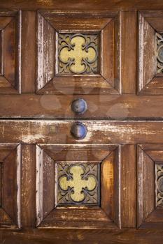 brass brown knocker and wood  glass door caronno varesino varese italy