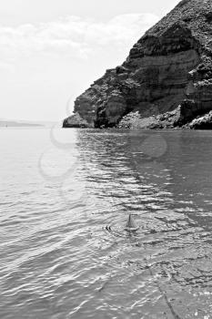 in europe greece santorini island hill and rocks on the summertime beach 