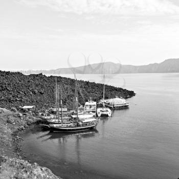 in europe greece santorini island hill and rocks on the summertime beach 