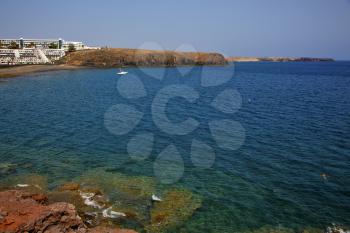 coastline lanzarote  in spain musk pond beach  water yacht boat  and summer 
