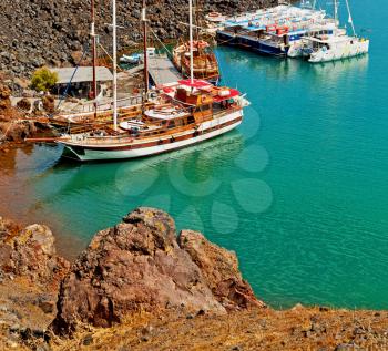 in europe greece santorini island hill and rocks on the summertime beach 