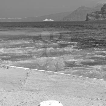 in europe greece santorini island hill and rocks on the summertime beach 