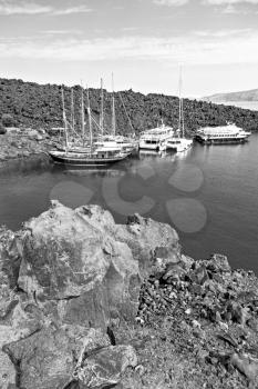 in europe greece santorini island hill and rocks on the summertime beach 