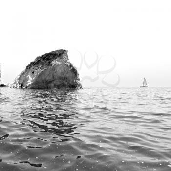 in europe greece santorini island hill and rocks on the summertime beach 