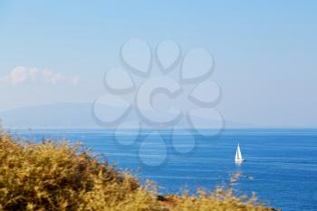 in europe greece santorini island hill and rocks on the summertime beach 