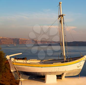 sailing in europe greece santorini island hill  and rocks on the summertime beach sunset boat