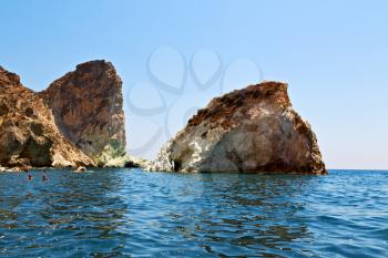 in europe greece santorini island hill and rocks on the summertime beach 