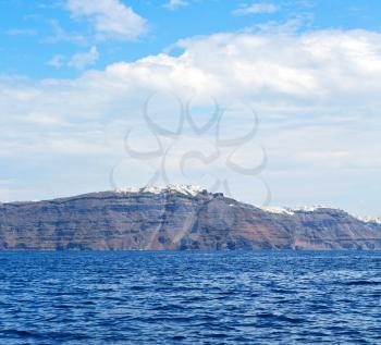 in europe greece santorini island hill and rocks on the summertime beach 