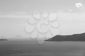 in europe greece santorini island hill and rocks on the summertime beach 
