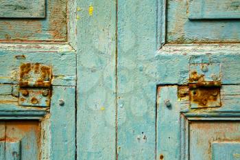   piece of colorated green wood as a window door in lanzarote spain
 