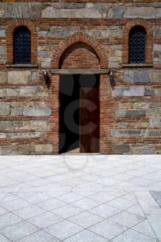  italy  lombardy     in  the besnate   old   church  closed brick tower      wall