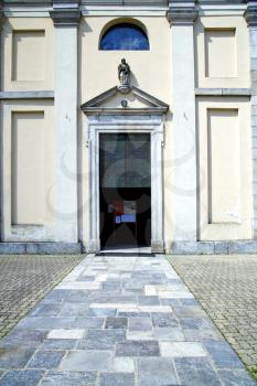   italy  sumirago church  varese  the old door entrance and mosaic sunny daY 
