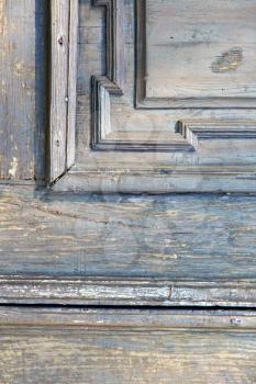 in  italy  patch lombardy    cross milan blur   abstract   rusty brass brown knocker  a  door curch  closed wood