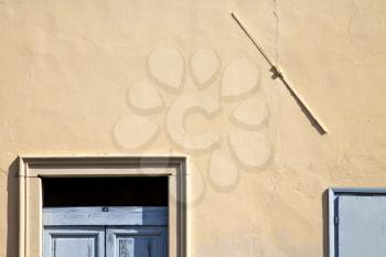 abstract in venegono italy   the old  wall  and church door  