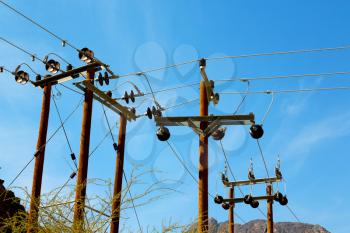  wood pylon energy and current line   in oman the electric cable