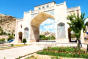 blur in iran shiraz the old gate arch historic entrance for the old city and nature flower
