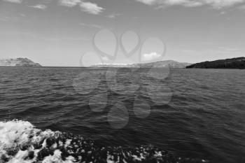 sailing in europe greece santorini island hill  and rocks on the summertime beach 