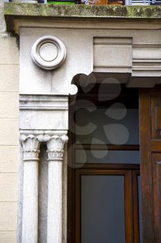  abstract church door   in italy   lombardy   column  the milano old      closed brick  