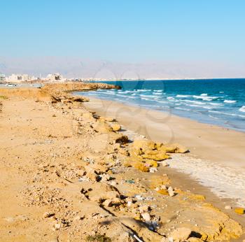 near sandy beach sky and  mountain  in oman arabic sea  the hill 