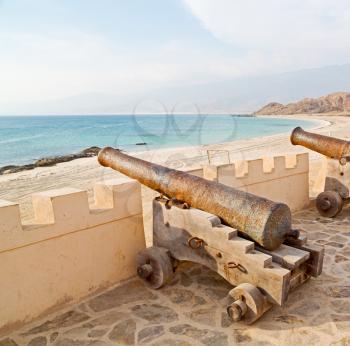 fort battlesment sky and   star brick in oman muscat the old defensive  sea mountain