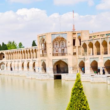 blu in iran  the old bridge and the river antique construction near nature