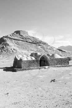 blur in iran near yazd the antique zoroastrian temple abandonated house and contruction